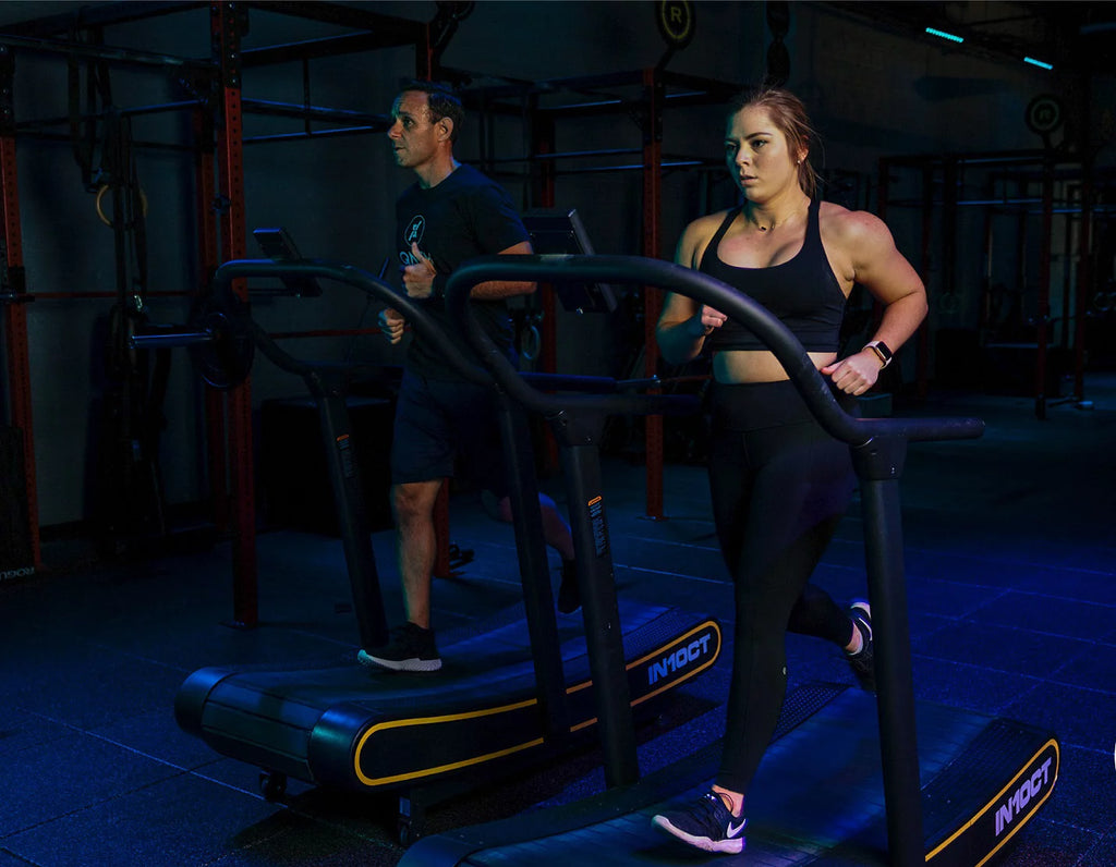 Sleek Black and Yellow Manual Curved Treadmill for Ultimate Home Workouts